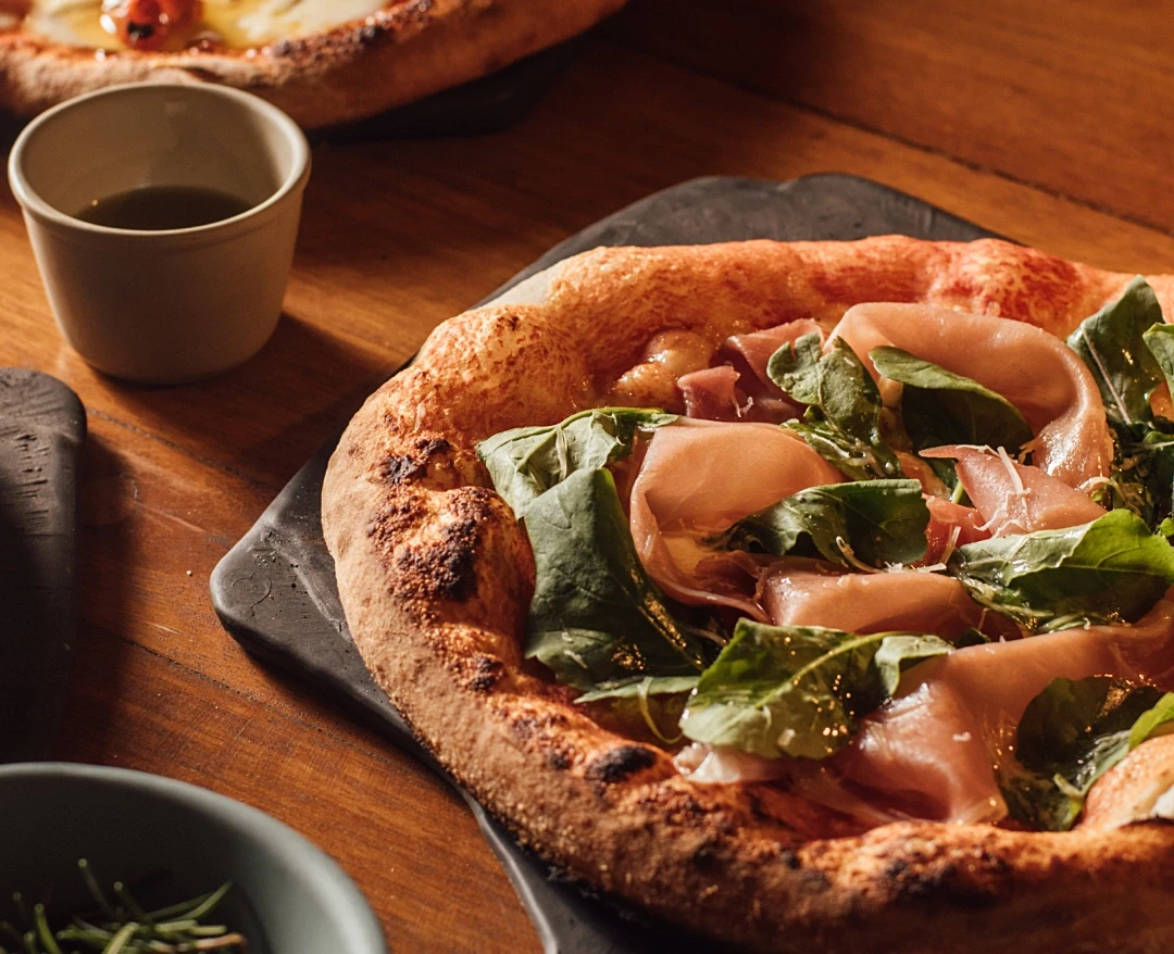 Pizza & feet in the sand: